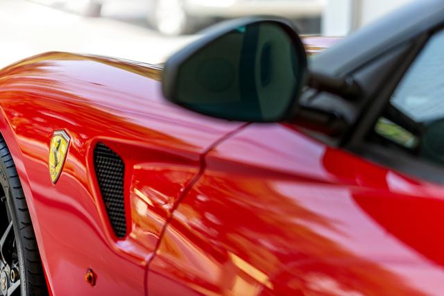 luxury-red-car-closeup-details-with-reflections-of-lights-in-it-ferrari-luxury-car-details-macro_t20_YNlKK0.jpg
