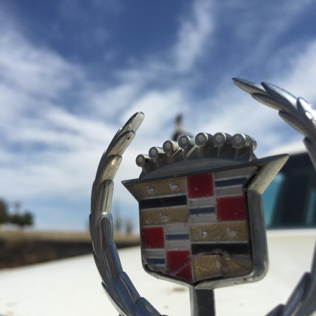 A Cadillac logo on the hood of a car | Twenty20