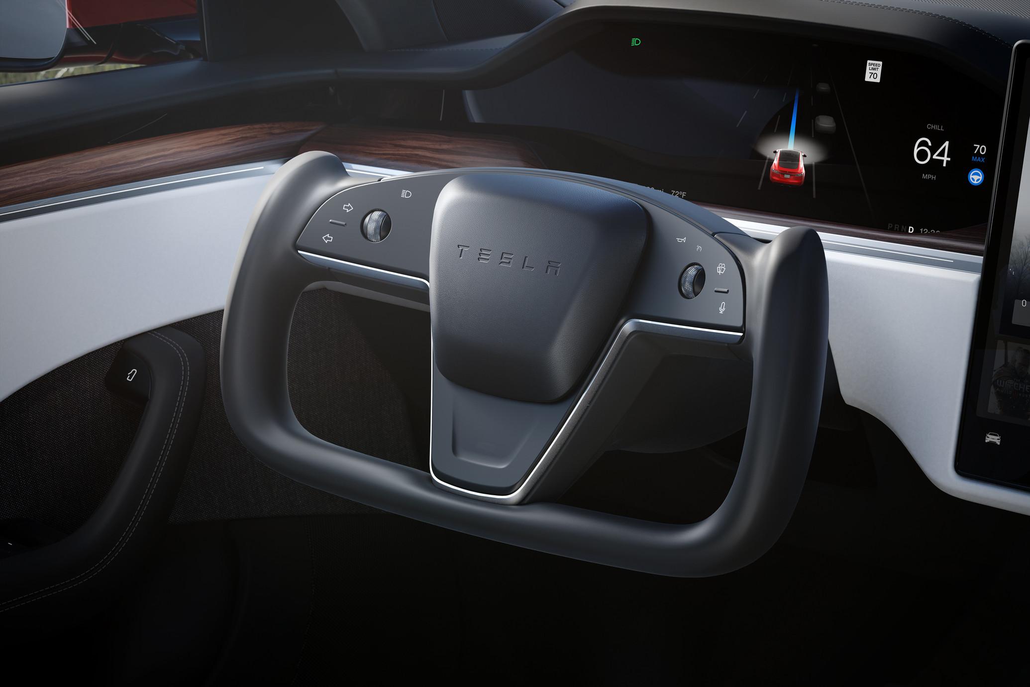 Closeup of the black geometric steering wheel of Tesla Model S Plaid.