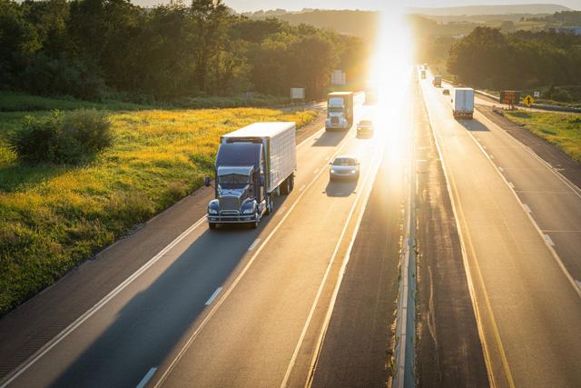 highway-and-semi-truck-18-wheeler-hauling-freight-at-sunset_t20_NxBKol.jpg