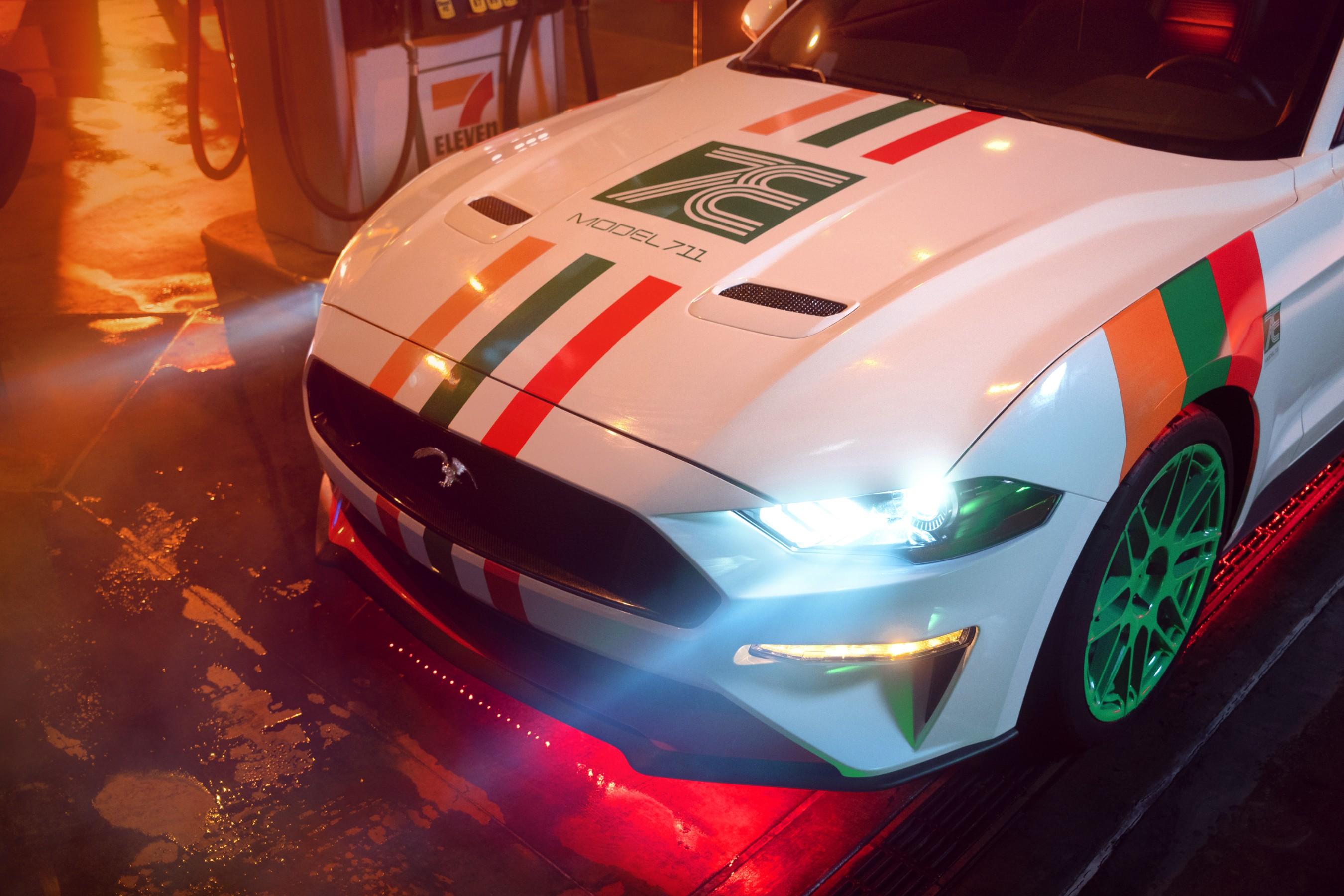 The customized 7-11 Mustang, white with red, green and orange stripes and green wheels. 