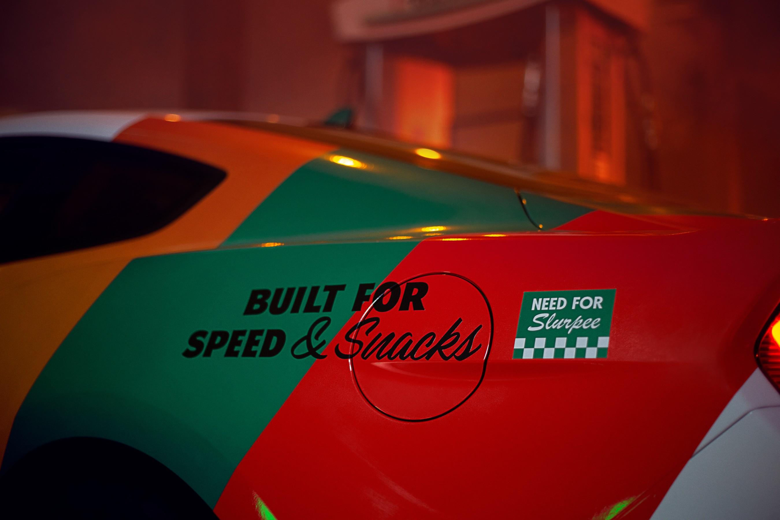 "Built for Speed and Snacks" and "Need for Slurpee" written next to the gas of the 7-11 customized Mustang.