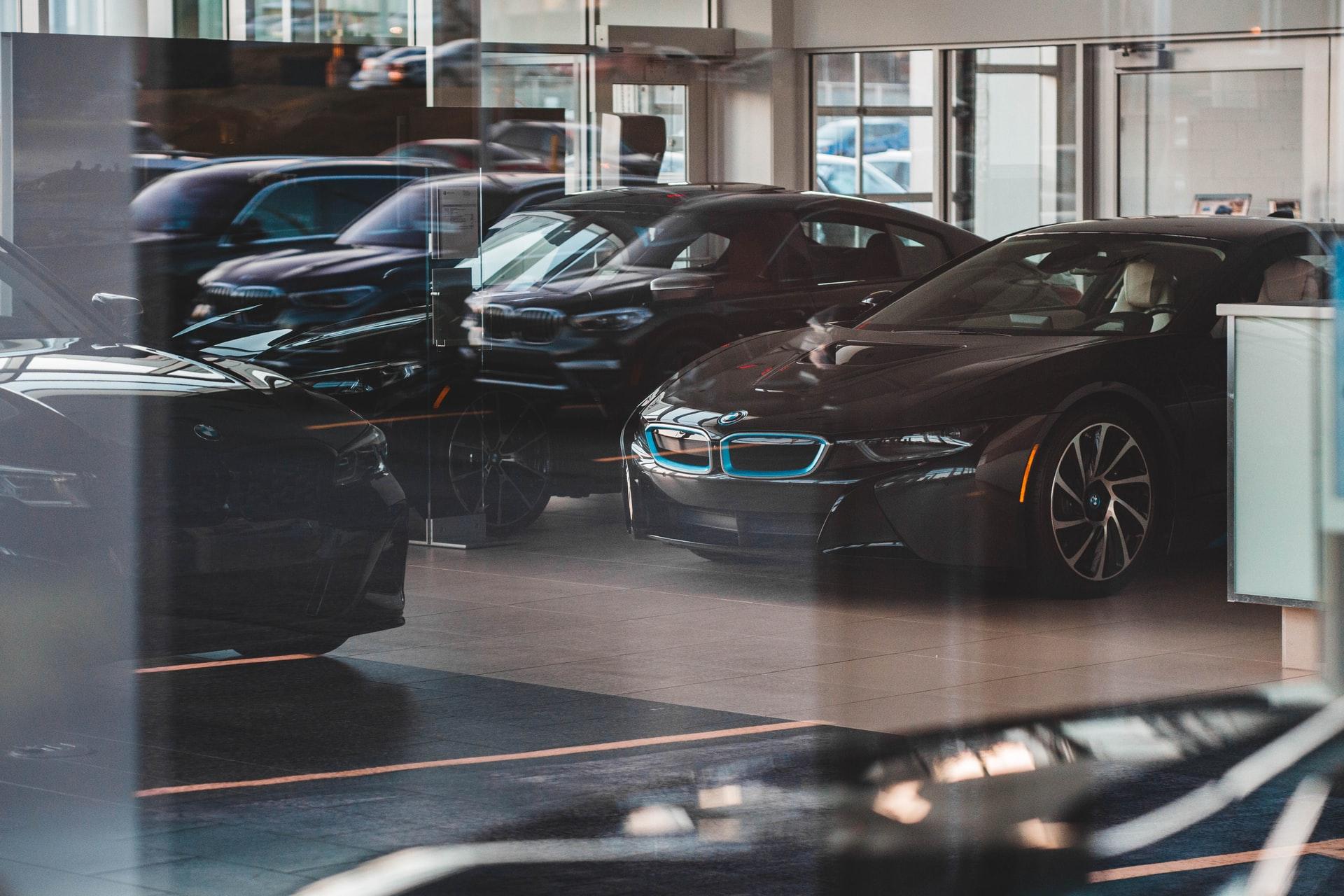 BMW luxury cars lined-up at a dealership.