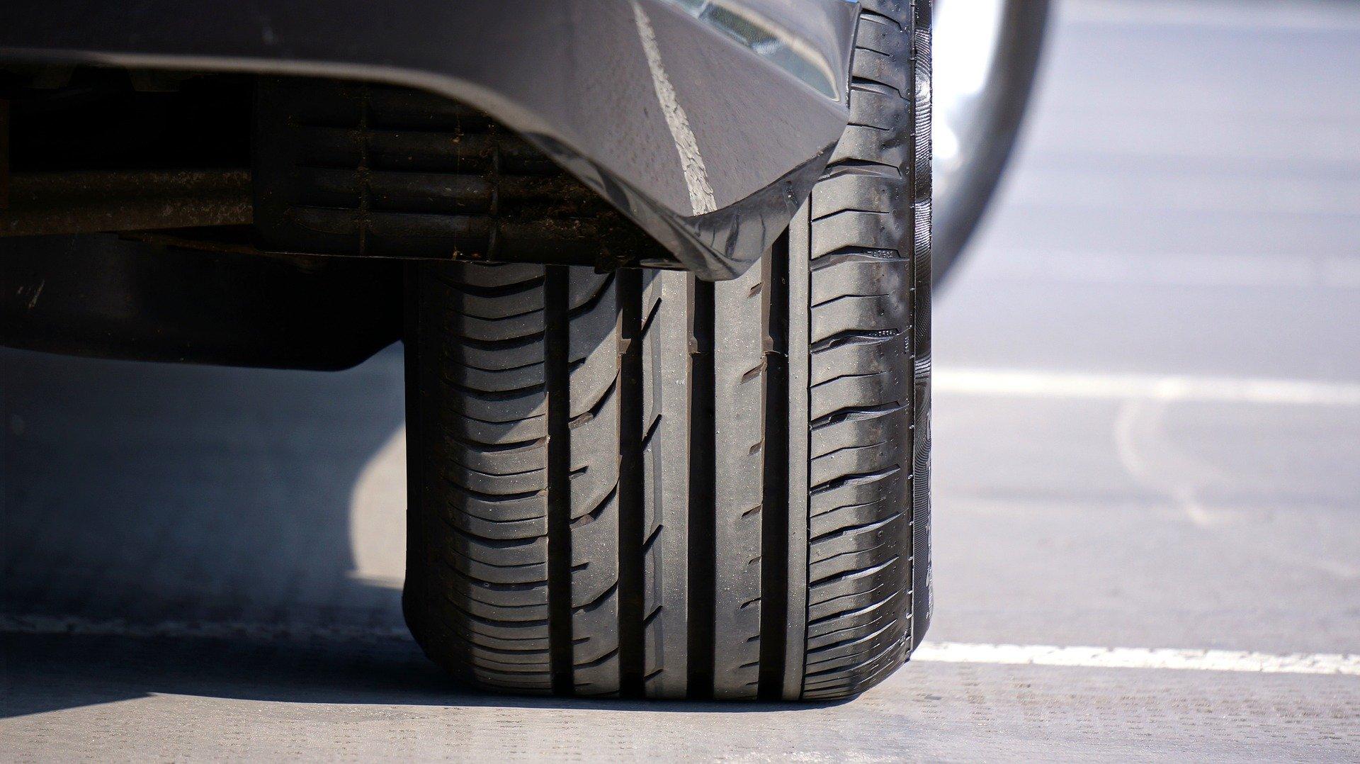 closeup of a car tire from the back of the car