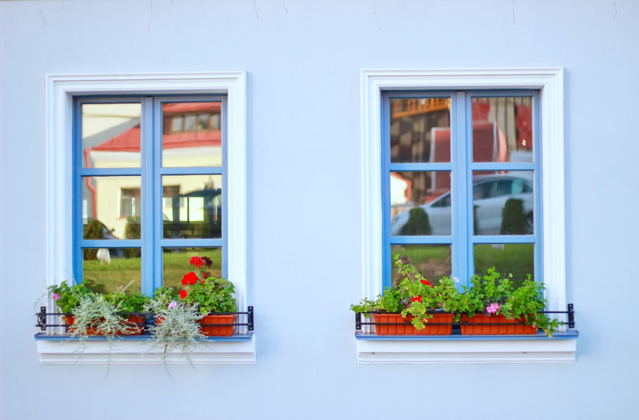 Adding flower boxes can add life to your windows.