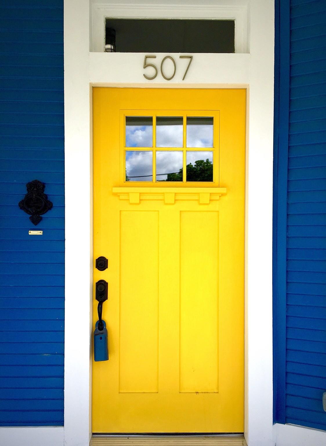 A painted yellow front door. 