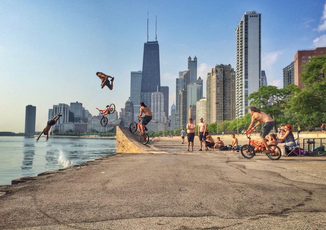 Having fun along the Chicago lakefront by diving into the water to cool off on a warm summer day.
