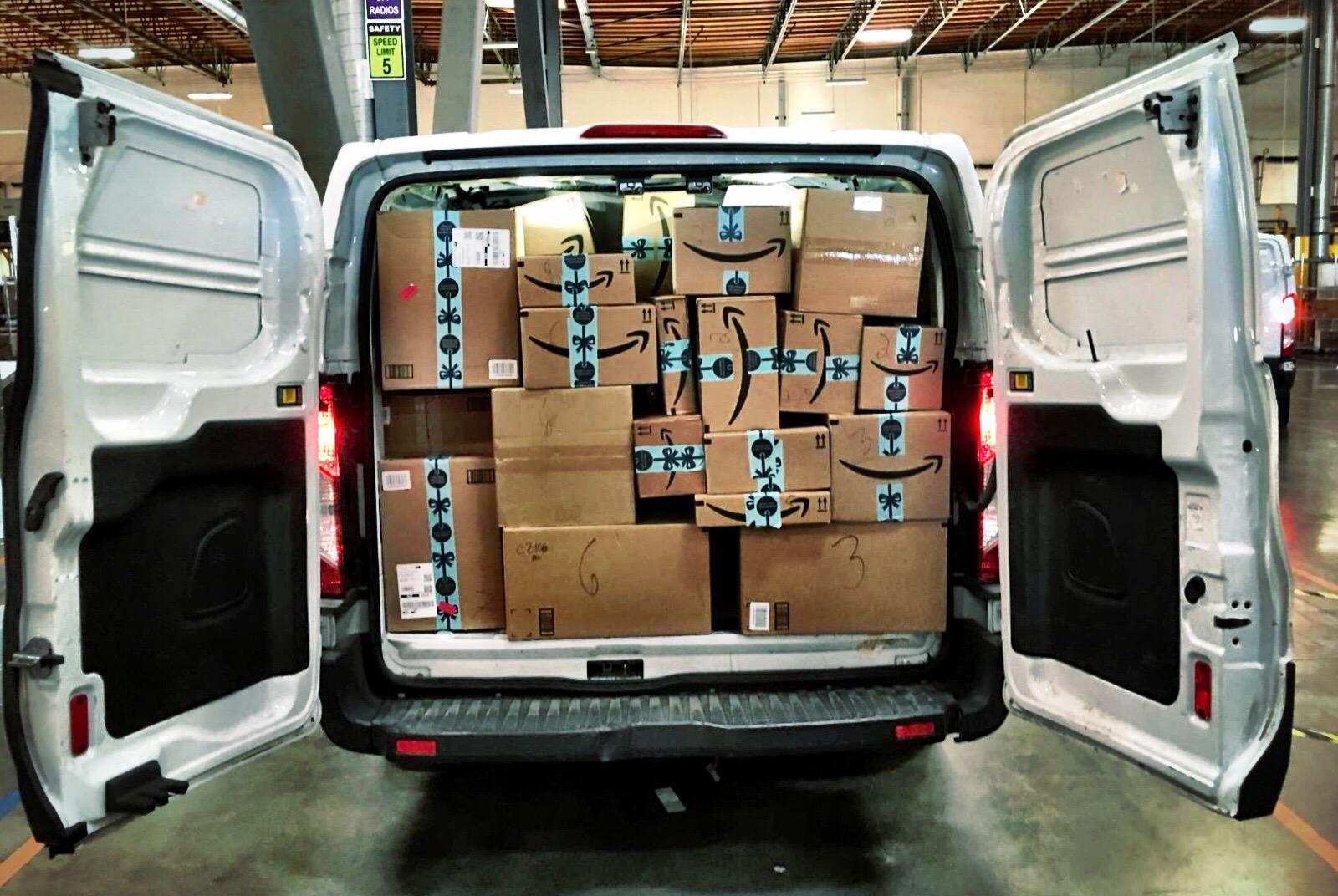 An Amazon van filled with packages.