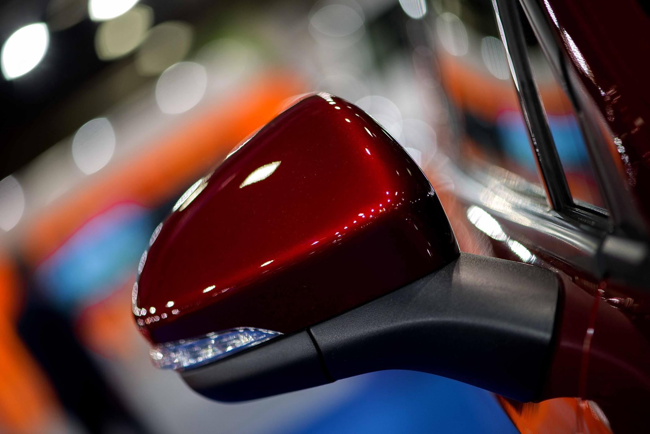 closeup of a red rear-view mirror