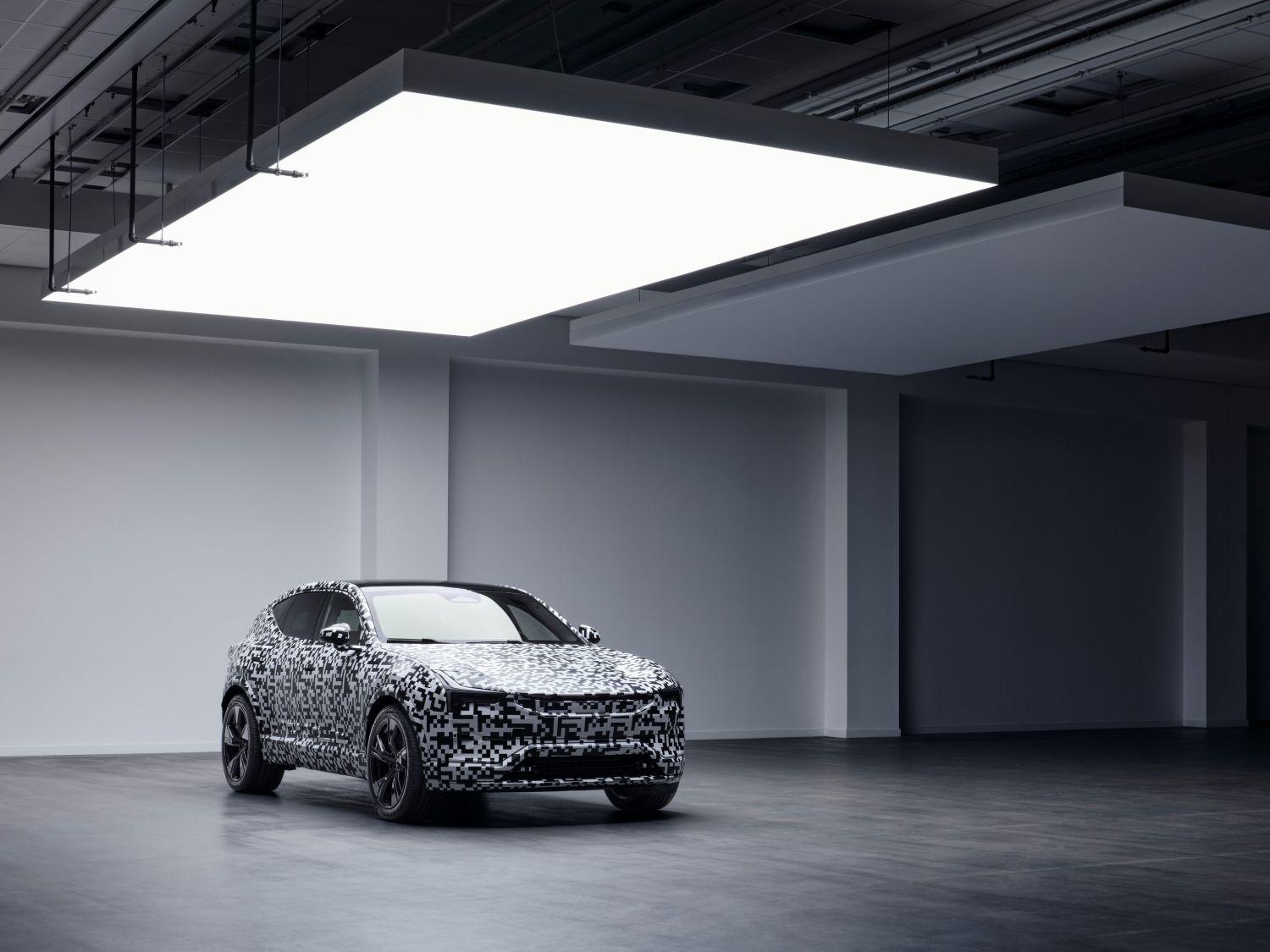 A Polestar 3 prototype on display in an empty room.