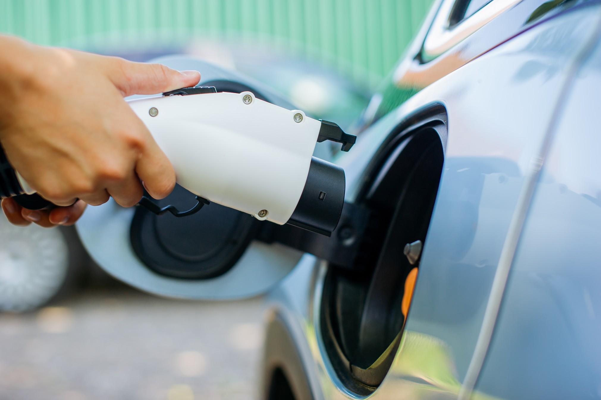 closeup of an electric car charging