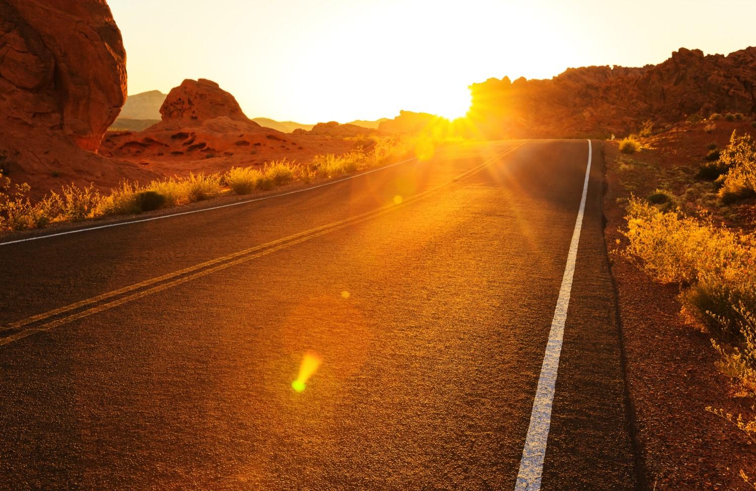 Sunset over paved road in Nevada.