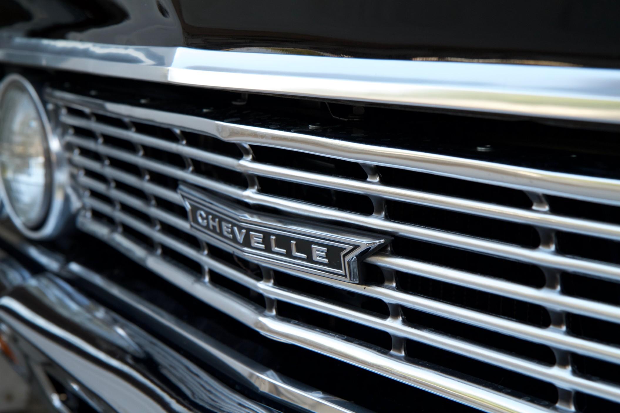 The front end headlights and grill of a classic Chevrolet Chevelle